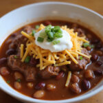 Beef Chili with Beans 13 Delicious bowl of beef chili with beans, topped with cheese and sour cream.