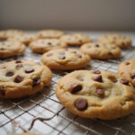 Chocolate Chip Cookies 13 Freshly baked, golden brown chocolate chip cookies cooling on a rack.