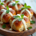 Delicious Creamy Hot Cross Buns served on platter, ready to eat.